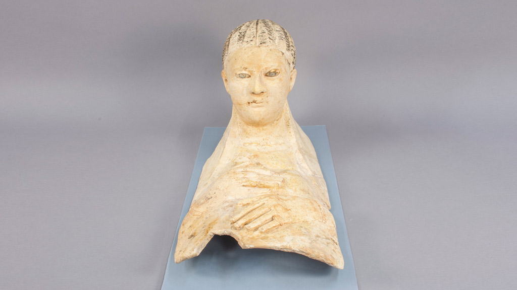 off-white fragment of a female funery portrait