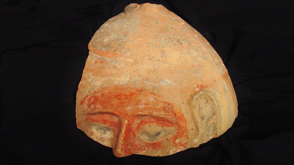 Yellow fragment of the upper half of a human face