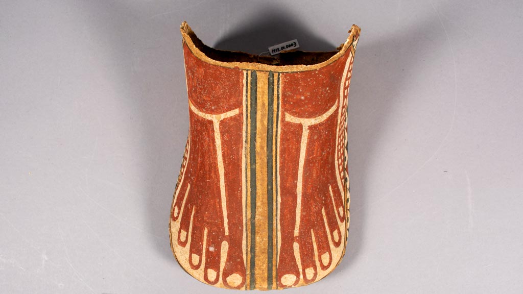 Foot covering for mummified person with colorful geometric patterns