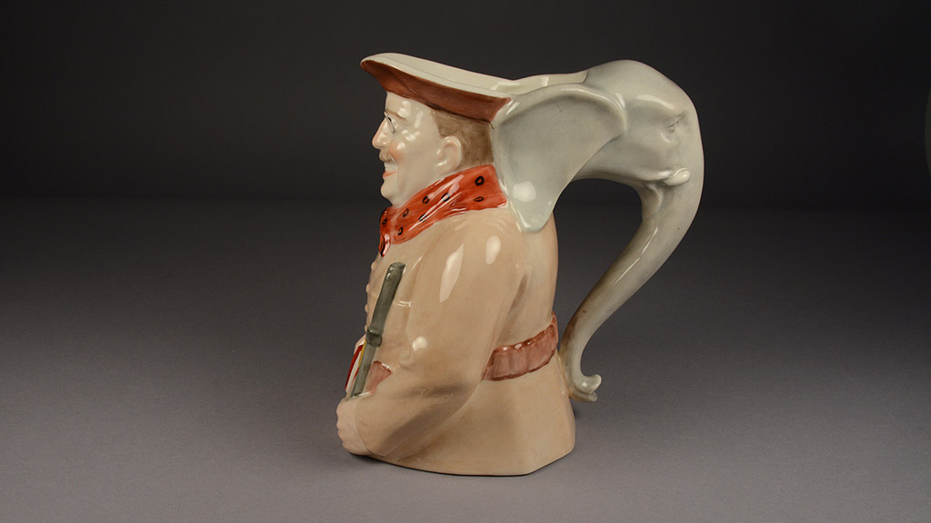 A jug depicting a smiling Theodore Roosevelt with the handle as an elephant trunk
