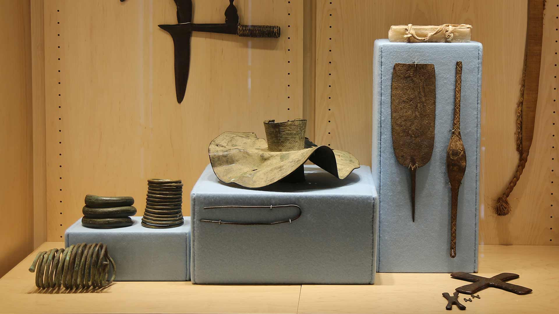view of case holding objects from the Mike and Lynn Noel Africana Collection