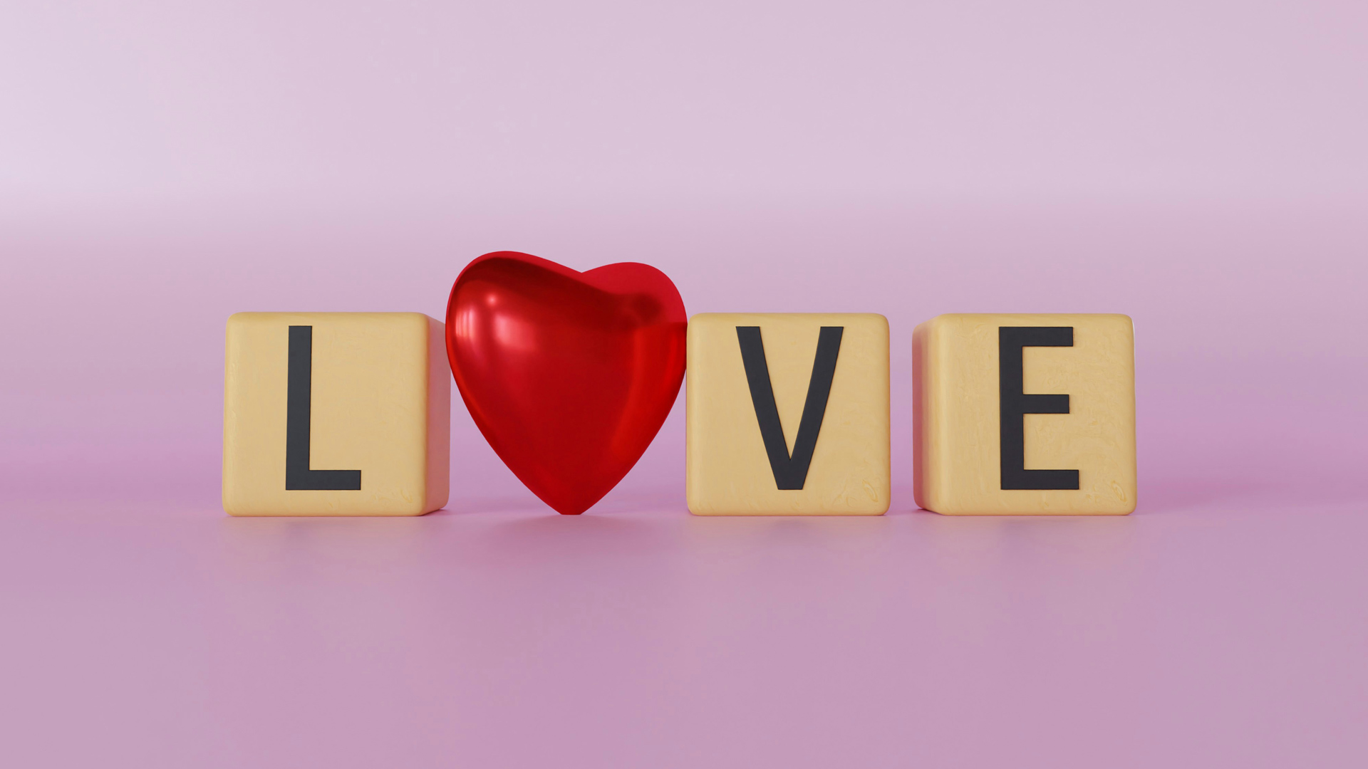 Wooden blocks arranged to spell 'Love' with a red heart replacing the 'O' on a pink background
